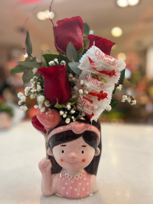 Cabeza porcelana con rosas y bombones. 